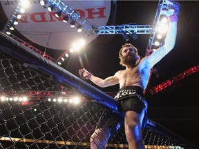 Michael Chiesa celebrates following his Lightweight victory over Anton Kuivanen of Finland at Honda Center in Anaheim in 2013.