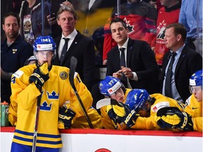 Elias Pettersson and head coach Tomas Monten of Team Sweden look on after losing to Team Canada during the 2017 IIHF World Junior Championship semifinal game at the Bell Centre on Jan. 4, 2017 in Montreal.