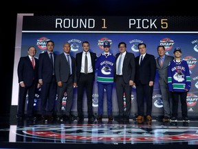 Elias Pettersson poses for photos after being selected fifth overall by the Vancouver Canucks during the 2017 NHL Draft at the United Center on June 23, 2017 in Chicago, Illinois.