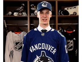Elias Pettersson poses for a portrait after being selected fifth overall by the Vancouver Canucks during Friday's NHL entry draft at the United Center in Chicago.