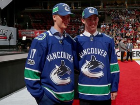 Elias Pettersson, left, and Kole Lind pose after being drafted by the Vancouver Canucks during the 2017 NHL draft at the United Center in Chicago.