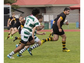 The Shawnigan Lake squad, in black, rolled past Earl Marriott last week en route to a B.C. high school boys rugby title. The championship tourney was played at Rotary Stadium in Abbotsford.