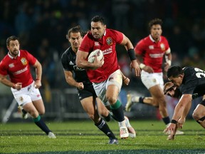 Ben Te'o (C) of the British and Irish Lions makes a break during the international rugby match between New Zealand's Maori All Blacks and the British and Irish Lions at Rotorua International Stadium in Rotorua on June 17, 2017.