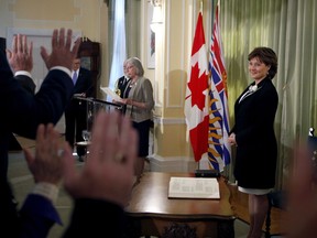 Premier Christy Clark looks on as her new provincial cabinet is sworn in during a ceremony at Government House in Victoria on Monday.
