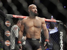 Demetrious Johnson reacts after defeating Tim Elliott during a mixed martial arts flyweight bout Saturday, Dec. 3, 2016, in Las Vegas.