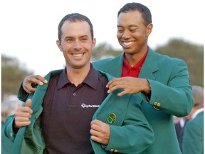 If you're a Canadian golf fan, this picture ranks right up with the best ever as Tiger Woods, right, helps Canadian Mike Weir put on the traditional green jacket after he won the 2003 Masters at the Augusta National Golf Club.