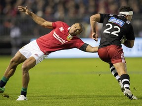 British and Irish Lions player Jonathan Joseph, left, attempts to tackle New Zealand Provincial Barbarians player Jonah Lowe during their game in Whangarei, New Zealand, Saturday, June 3, 2017. The Lions defeated the Barbarians 13-7.