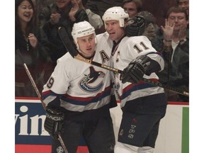 Former Canucks winger Alex Mogilny (left) has gotten strong consideration in recent years to join Mark Messier (right) in the Hockey Hall of Fame but continues to come up just short.