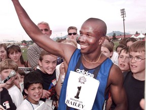 Canadian sprinter Donovan Bailey is mobbed by young fans after winning the men’s 100-metres race at the 1996 Harry Jerome International Track Classic.