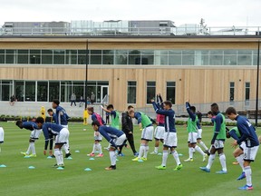 Players stretch outside the newly open Whitecaps FC National Soccer Development Centre (NSDC) at the University of British Columbia.