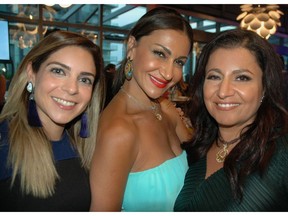 Neekoo Philanthropic Society board members Tara Amiri, Tandar Tanavoli and Saeedeh Salem greeted guests at the organization's annual summer mixer fundraiser held on Telus Garden's rooftop.