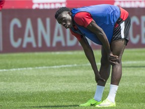 Canada's Alphonso Davies stretches during a practice Monday, June 12, 2017 in Montreal. Canada will face Curacao in a friendly game Tuesday.