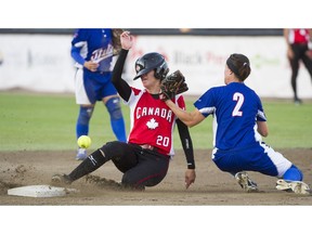 Canada's Megan Gurski  has her helmet knocked as she slides safely into second against Italy in a 2016 game at the WBSC XV women's World Softball Championship at Softball City in Surrey.