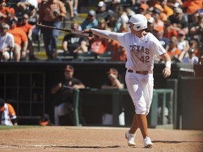 Texas' Kacy Clemens celebrates after scoring a run in the championship game in the Big 12 baseball tournament in Oklahoma City.