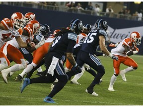 Chris Rainey of the B.C. Lions takes off with the ball during Friday's CFL action in Toronto. The host Argos lost 28-15 to the Lions, who erased a 15-10 fourth quarter deficit.