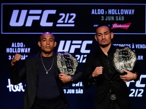 RIO DE JANEIRO, BRAZIL - APRIL 11: UFC Featherweight Champion Jose Aldo of Brazil (L) and challenger Max Holloway of the United States pose for photographers during the UFC 212 press conference at Morro da Urca on April 11, 2017 in Rio de Janeiro, Brazil. (Photo by Buda Mendes/Getty Images)