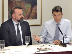 Vancouver Mayor Gregor Robertson, right, with mobility pricing executive director Daniel Firth, speaks to the media Tuesday during a Mayors Council and TransLink board meeting to officially announce the appointments to an independent commission on mobility pricing.