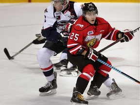 Pesky Petrus Palmu of the Owen Sound Attack (right) in action against Patrick Sanvido and the Windsor Spitfires in the OHL during the 2014-15 season.