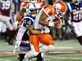 Alouettes defensive back Brandon Dozier takes down B.C.'s Brian Burnham during the second half of the Lions' 23-16 victory in Montreal.