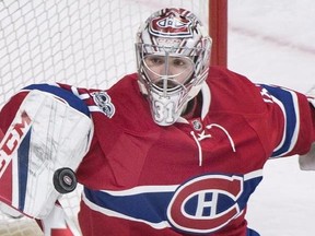 Montreal Canadiens goalie Carey Price makes a save during second period NHL hockey action against the Ottawa Senators, in Montreal on Saturday, March 25, 2017. Carey Price will soon be the highest-paid goaltender in hockey.The Montreal Canadiens signed the 29-year-old to an eight-year extension that reportedly carries an annual cap hit of US$10.5 million. THE CANADIAN PRESS/Graham Hughes
