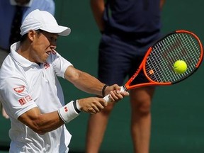 Japan&#039;s Kei Nishikori returns to Spain&#039;s Roberto Bautista Agut during their Men&#039;s Singles Match on day five at the Wimbledon Tennis Championships in London Friday, July 7, 2017. (AP Photo/Alastair Grant)