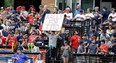 A fan holds up a sign reading &ampquot;Rally for Tito&ampquot; in the first inning of a baseball game between the Detroit Tigers and the Cleveland Indians, Friday, July 7, 2017, in Cleveland. Indians manager Terry Francona underwent a procedure Thursday to correct an irregular heartbeat that sidelined him for a few games and will prevent him from managing in the All-Star Game next week.(AP Photo/Tony Dejak)