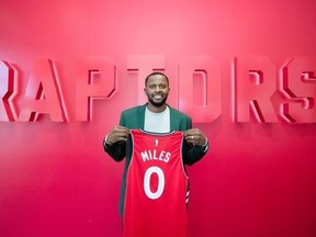 Newly acquired Toronto Raptors player C.J. Miles poses with his jersey in Toronto, Tuesday July 18, 2017. THE CANADIAN PRESS/Mark Blinch