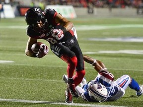 Ottawa Redblacks wide receiver Brad Sinopoli (88) scores a touchdown past Montreal Alouettes defensive back Tyree Hollins (26) during second half CFL football action in Ottawa on Wednesday, July 19, 2017. THE CANADIAN PRESS/Sean Kilpatrick