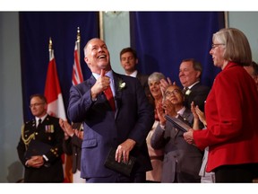 Premier John Horgan gives a thumbs up after he was sworn as premier by Lieutenant-Governor Judith Guichon on July 18.