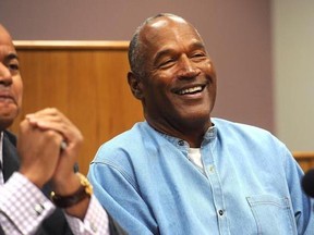 Former NFL football star O.J. Simpson laughs as he appears via video for his parole hearing at the Lovelock Correctional Center in Lovelock, Nev., on Thursday, July 20, 2017. Simpson was granted parole Thursday after more than eight years in prison for a Las Vegas hotel heist, successfully making his case in a nationally televised hearing that reflected America&#039;s enduring fascination with the former football star. (Jason Bean/The Reno Gazette-Journal via AP, Pool)