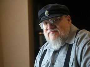 FILE - In this March 12, 2012 file photo, George R.R. Martin, author of the popular book series &ampquot;A Song of Ice and Fire,&ampquot; which inspired the hit HBO series &ampquot;Game of Thrones&ampquot; poses in Toronto. Martin says the next ‚ÄúSong of Ice and Fire‚Äù book has a real chance of coming out in 2018. In a weekend posting on his web site, Martin wrote that he is working hard on ‚ÄúThe Winds of Winter,‚Äù the long-awaited sixth volume in the series. He added that he has ‚Äúgood days and bad days‚Äù and is still m