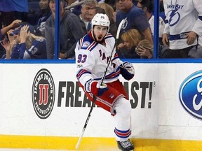 FILE - In this March 6, 2017, file photo, New York Rangers&#039; Mika Zibanejad, of Sweden, celebrates his game-winning overtime goal during an NHL hockey game against the Tampa Bay Lightning, in Tampa, Fla. The New York Rangers have signed center Mika Zibanejad to a $26.75 million, five-year deal. General manager Jeff Gorton announced the contract Tuesday morning, July 25, 2017, before the team and Zibanejad were set to go to arbitration. (AP Photo/Mike Carlson, File)