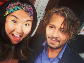 Johnny Depp poses with a fan at The Blackbird in Vancouver.
