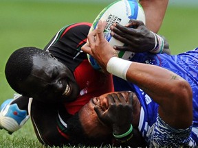 Kenya and Samoa tussle at the 2017 Rugby World Cup 7s in Moscow.