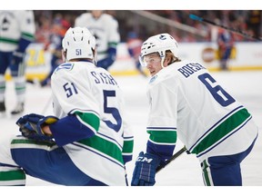 Troy Stecher, left, and Brock Boeser will be looking to make an impression, and the Vancouver Canucks' opening-night lineup this season.