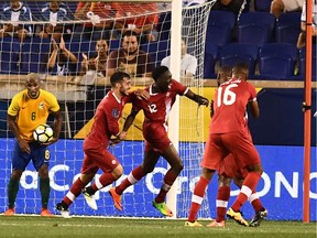 Canadian midfielder Alphonso Davies (C) celebrates after scoring a goal against French Guiana during their 2017 Concacaf Gold Cup Group A match at the Red Bull Arena in Harrison, New Jersey, on July 7, 2017.