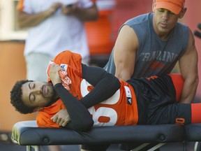 Chris Williams gets some work done by a member of the B.C. Lions' training staff.