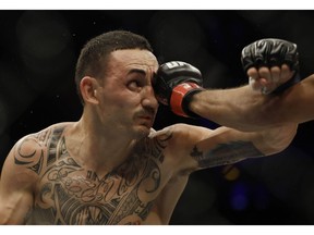 Max Holloway takes a shot to the head in his bout against Jose Aldo of Brazil in Rio de Janeiro last month.