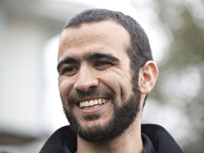 This May 7, 2015, file photo shows former Guantanamo Bay prisoner Omar Khadr speaking to the media outside his lawyer Dennis Edney's home in Edmonton.