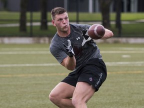 Adam Zaruba practices route-running and catching during a workout with T-Birds quarterback Michael O'Conner at UBC.