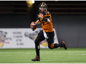 B.C. Lions' quarterback Travis Lulay runs with the ball during the second half of a CFL football game against the Winnipeg Blue Bombers at B.C. Place on Friday.