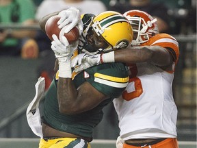 B.C. Lions defensive back Buddy Jackson (3) tries to block the catch by Eskimos slotback D'haquille Williams during second-half CFL action in Edmonton on Friday.