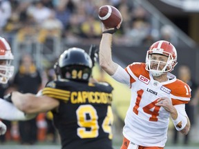 Travis Lulay throws during first-half CFL action against the Hamilton Tiger-Cats.