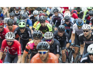 The mass start of the Mens 50 lap / 60 km Global Relay Gastown Grand Prix , Vancouver, July 12 2017.