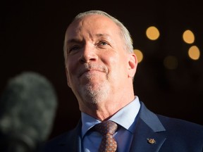 John Horgan

British Columbia Premier-designate, NDP Leader John Horgan pauses while speaking outside Government House after meeting with Lt-Gov. Judith Guichon in Victoria, B.C., on Thursday, June 29, 2017. THE CANADIAN PRESS/Darryl Dyck ORG XMIT: VCRD131
DARRYL DYCK,