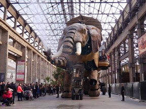 A giant mechanical elephant belches steam for the crowd at Les Machines de l’Ile in Nantes.