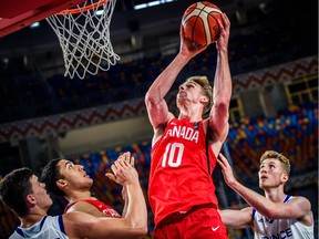 Grant Shepard plays against France at the World U-19 basketball championship.