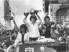 Whitecaps players in parade and fans in Vancouver after winning the 1979 Soccer Bowl - goalie Phil Parkes (holding NASL championship trophy) and captain John Craven.