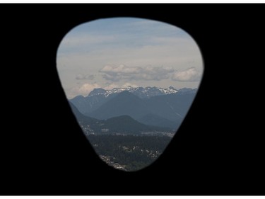 View through the distinctive 'guitar pick' windows from the top floor of the 55-storey Civic Hotel in Surrey