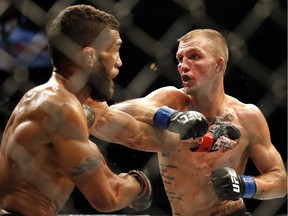 Jason Knight, right, fights Jim Alers during their featherweight mixed martial arts bout at United Center in Chicago last July.